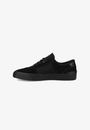 Black sneakers featuring a smooth suede and fabric upper, lace-up closure, a textured sole, and subtle branding on the tongue.