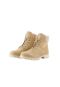 Beige enkellaarzen van daim, met een zachte bontkraag, ronde neus, vetersluiting aan de voorkant en een gestructureerde rubberen zool met lichte groeven.