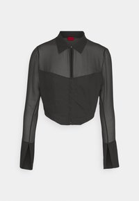 Schwarze, kurz geschnittene Jacke mit einem einfarbigen Oberteil und durchsichtigen langen Ärmeln. Verfügt über einen Kragen und einen Reißverschluss vorne. Sauberes, minimalistisches Design.