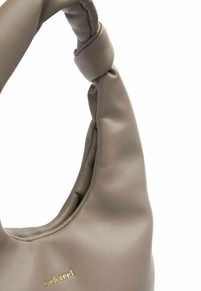 Gray leather hobo bag with a knotted handle and gold logo accent. Soft texture with a rounded shape and subtle sheen.