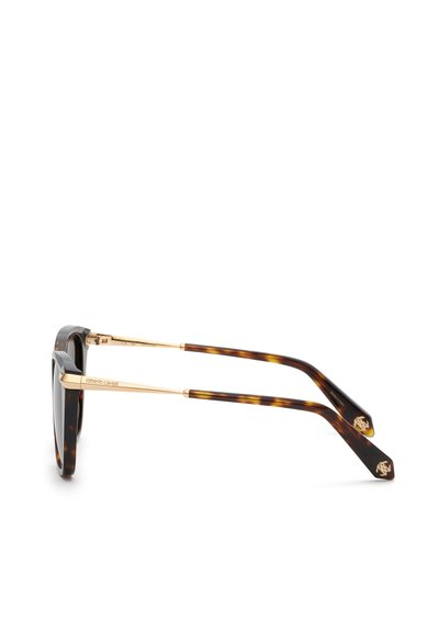 Vue de côté de lunettes de soleil à monture métal écaille et or avec verres foncés et détails du logo sur les branches et les embouts.