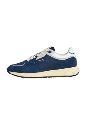 Navy blue athletic shoe with suede and fabric materials, cream rubber sole, beige laces, and branding detail on the side.