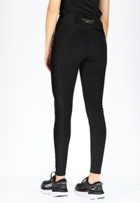Swedemount PERFORMANCE TIGHTS W - Leggings - glossy black