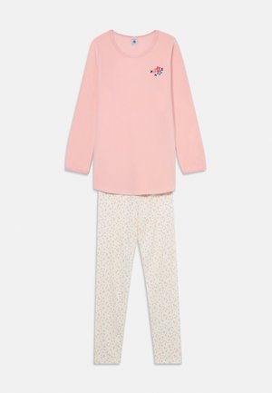 Rosa Langarmshirt mit floralem Stickerei, kombiniert mit cremefarbenen Leggings, die ein mehrfarbiges Blumenmuster aufweisen.