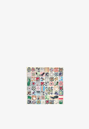 Multicolored fabric featuring a grid of various floral and abstract patterns, with some blocks displaying text, on a cream background.