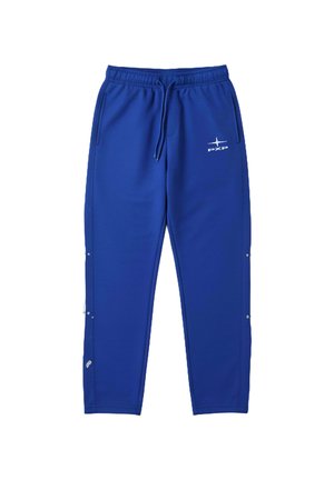 Blauwe joggingbroek van zachte stof, met een elastische tailleband en trekkoord, zijzakken en een wit logo op het linkerbeen.