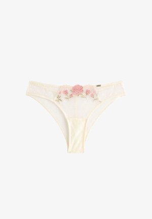 Roomkleurig bikini-ondergoed voor vrouwen met doorschijnende stof met stippen en roze rozenborduursel aan de voorkant van de tailleband.
