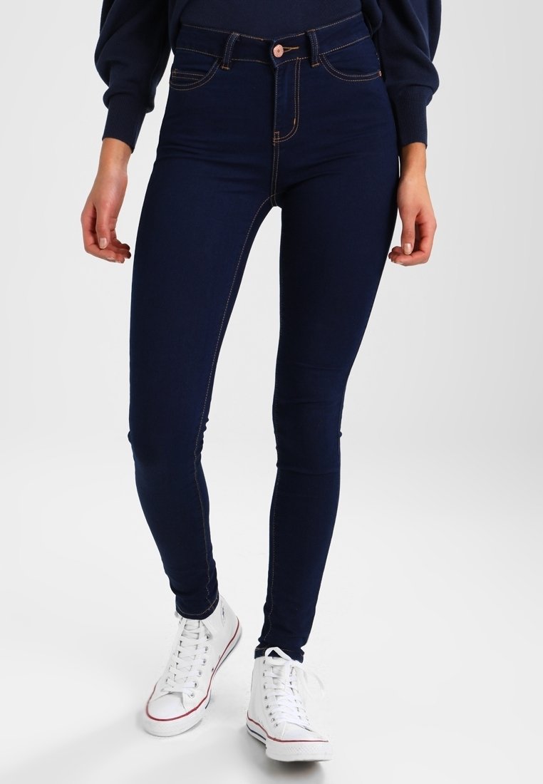 Mörkblå högmidjade jeggings i stretchig denim, med orange sömmar, framfickor och en elegant, figurnära design.