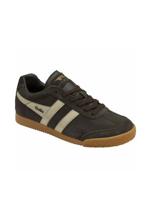 Dark brown suede sneaker with light beige stripes, round toe, and rubber sole featuring textured grip. Gold logo detail on the tongue.