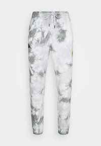 Grå och vit tie-dye jerseybyxor med elastisk midja, vit dragsko, svart logotyp på vänster lår och liten gul lapp på höger lår.