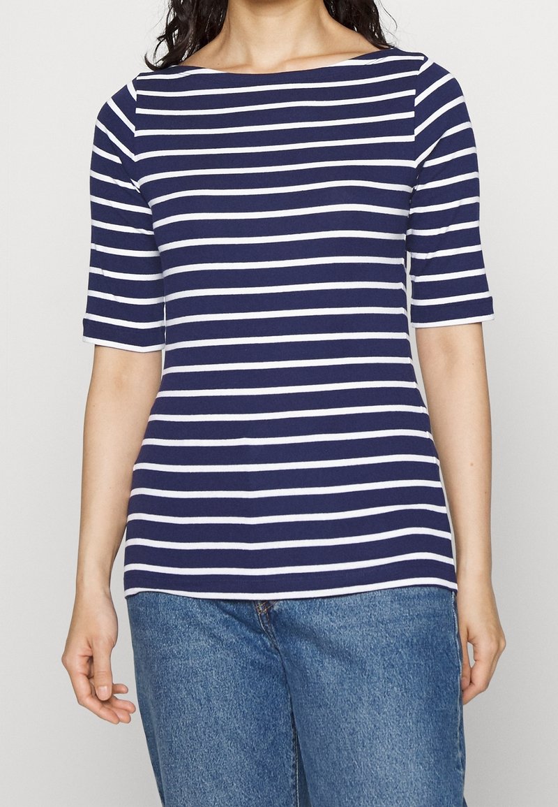 Navy and white striped t-shirt with a boat neckline and short sleeves, made from soft fabric. Casual fit, paired with light blue jeans.