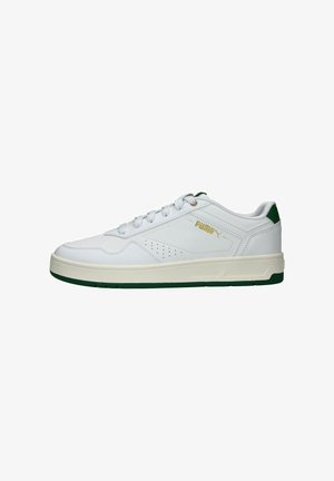 White sneaker with green accents, lace-up design, smooth synthetic upper, and lightly textured sole. Features branding on the side.