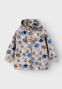 Veste à capuche en tissu beige ornée de motifs de voitures anciennes colorées en bleu, marron et gris. Fermeture éclair à l'avant, poignets élastiques.