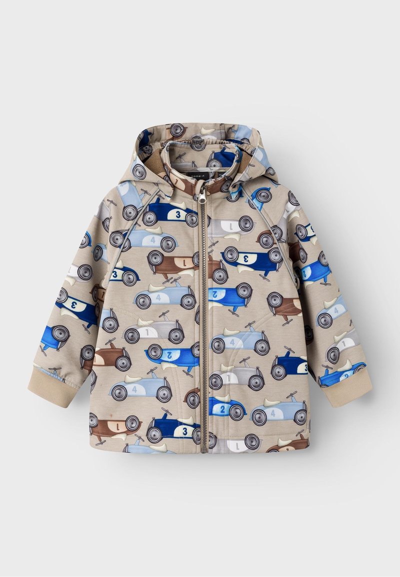 Veste à capuche en tissu beige ornée de motifs de voitures anciennes colorées en bleu, marron et gris. Fermeture éclair à l'avant, poignets élastiques.