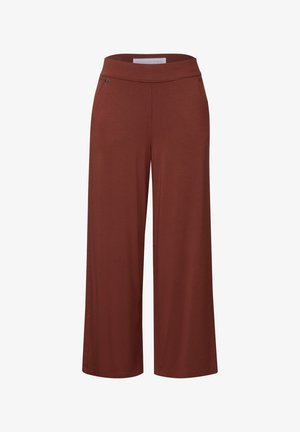 Pantalons larges dans une couleur orange brûlé riche. Fabriqués à partir d'un tissu doux avec une taille élastique et un minimalisme dans les détails.