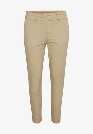 Bež pamučne hlače slim kroja, s prednjim patentnim zatvaračem, četiri džepa i suptilnim detaljima šivanja. Glatka tekstura.