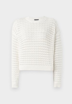 White knitted sweater featuring a textured pattern, round neckline, long sleeves, and ribbed cuffs and hem. Cropped design.