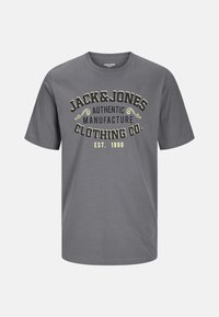 Gray short-sleeve t-shirt featuring "JACK & JONES AUTHENTIC MANUFACTURE CLOTHING CO. EST. 1990" in yellow and black print. Soft cotton fabric.