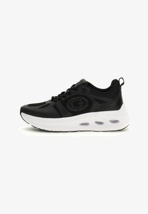 Black athletic shoe with mesh and synthetic material, featuring a white midsole, translucent air pockets, and a prominent logo on the side.