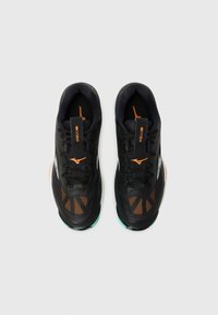 Black athletic shoes with orange accents and mesh detailing. Features textured upper, laces, and a rubber sole with a green trim.