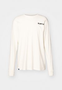 Camicia in cotone bianco sporco a maniche lunghe con collo a giro. Presenta un piccolo logo nero sul petto sinistro. Tessuto morbido, vestibilità comoda.