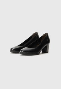 Black leather block heel shoes with a smooth finish, rounded toe design, and low-cut sides for easy wear. Sole features a textured grip.