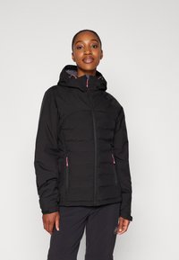 Black insulated jacket with a zip front, hood, and pink accents. Features two side pockets and a quilted design for warmth.
