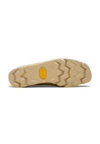 Barna Vibram talp, amelyen zigzag mintázat és középen sárga logó található. A felülete durva, és tapadásra van tervezve.