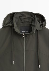 Dark green hooded jacket with front zipper and drawstrings, showing the "Massimo Dutti" brand label inside the collar.