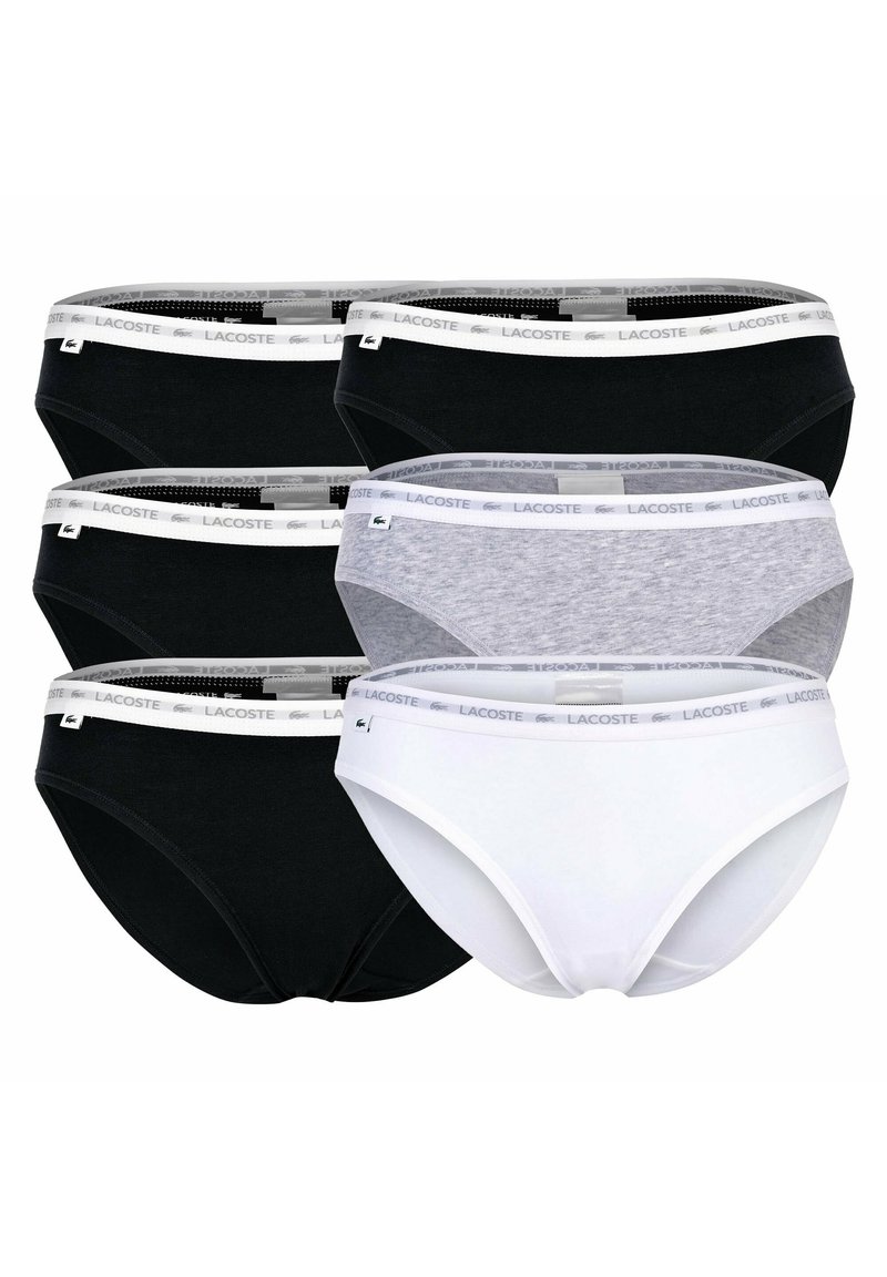 Cinque coppie di mutandine donna in nero, bianco e grigio. Presentano un morbido elastico in vita con il marchio Lacoste. Materiale in misto cotone.