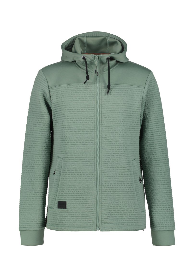 Giacca con cappuccio in verde tenue, con tessuto testurizzato, chiusura a zip frontale e tasche laterali. I polsini e l'orlo sono lisci con un pannello a contrasto.