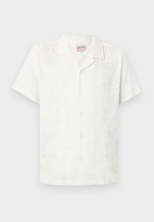 White short-sleeve button-up shirt made of linen with floral embroidery along the left side, featuring a camp collar and a relaxed fit.