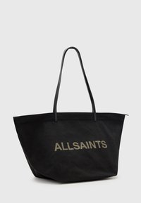 Borsa tote in tela nera con struttura piatta, manici lunghi neri e logo "ALLSAINTS" in rilievo di colore contrastante frontale.