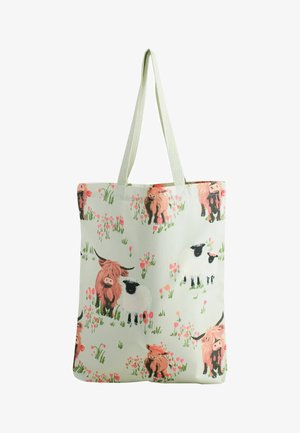 Stofftasche in hellgrün mit Bauernhoftier-Print, braune Kühe und weiße Schafe zwischen pinken Blumen. Mittelgroß mit langen Henkeln.