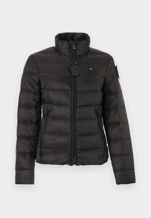 Black quilted puffer jacket with high collar, front zipper, zippered side pockets, and branded patches on chest and left sleeve.