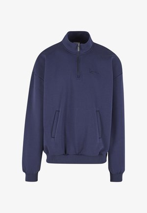 Marineblauer Pullover aus weichem Stoff, mit halbem Reißverschluss am Kragen, langen Ärmeln und zwei Fronttaschen.