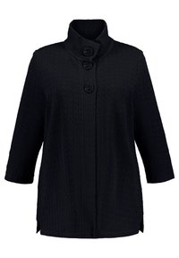 Black textured long-sleeve jacket with a high collar and three large buttons down the front, featuring side slits at the hem.