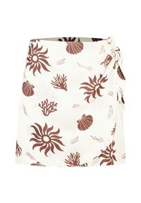 Jupe portefeuille en tissu crème clair avec un motif de coquillages et de coraux marron. Texture lisse avec fermeture à nouer sur le côté et Ourlet arrondi.