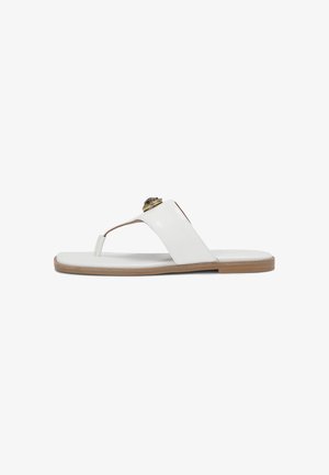 White flat sandals made of leather, featuring a thong design, smooth texture, and a gold accent on the strap. Thin, light brown sole.