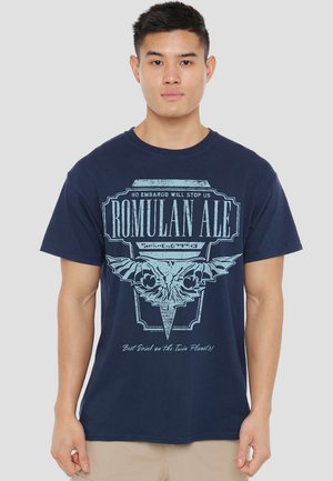 Navy blue cotton t-shirt featuring a graphic design with text "ROMULAN ALE" in light blue, depicting an emblem with bird-like features.