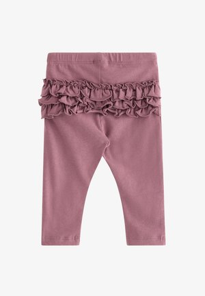 Różowe legginsy z falbaniastą fakturą w pasie. Wykonane z miękkiego materiału, charakteryzujące się dopasowanym krojem i długością do kostek.