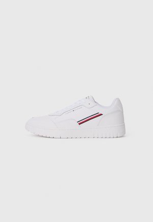 White sneakers made of smooth leather, featuring a solid white rubber sole, with red and blue stripe accents on the side.