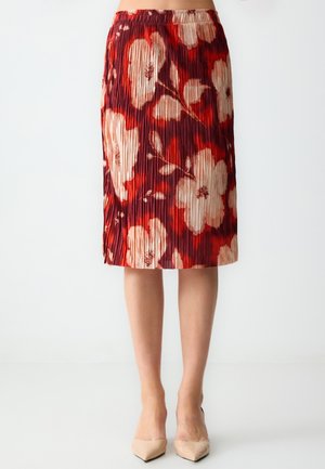 Gonna plissettata con audaci motivi floreali in rosso, bianco e beige. Design con vita elastica, lunghezza al ginocchio e texture di tessuto liscia.