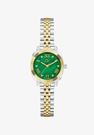 Reloj de pulsera bicolor en plata y oro con esfera verde, números romanos dorados, marcadores de horas con diamantes y bisel dorado.