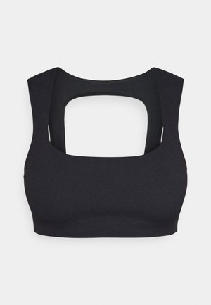 Black sports bra with a sleeveless design, featuring a square cutout in the back and smooth stretch fabric texture.