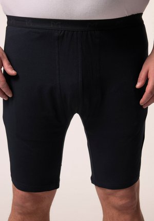 Pantaloni shorts neri realizzati in tessuto morbido, caratterizzati da una vita elasticizzata con un logo discreto. Lungo fino al ginocchio, con un design liscio e privo di decorazioni.