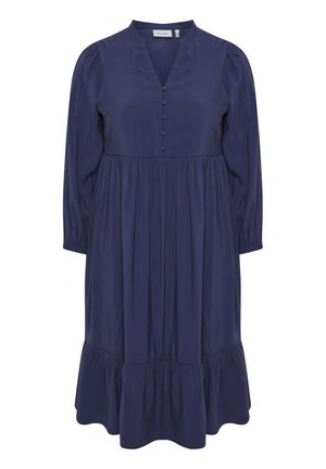 Námořnicky modré šaty s výstřihem do V, dlouhými rukávy a knoflíkovými detaily. Mají plisovanou sukni se stupňovitou volánkovou spodní částí. Měkká textilie.