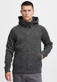 Dark gray fleece hooded jacket with a zip front, textured pattern, side pockets, and adjustable drawstrings on the hood.