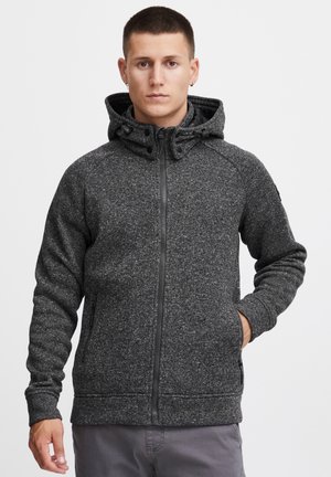 Dark gray fleece hooded jacket with a zip front, textured pattern, side pockets, and adjustable drawstrings on the hood.