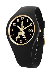 Orologio in silicone nero con una lunetta dorata, caratterizzato da un quadrante nero, numeri bianchi e un design della Torre Eiffel al centro.